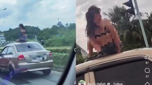 Wanita Berbikini Di Atas Bumbung Kereta Buat Orang Ramai Terkejut